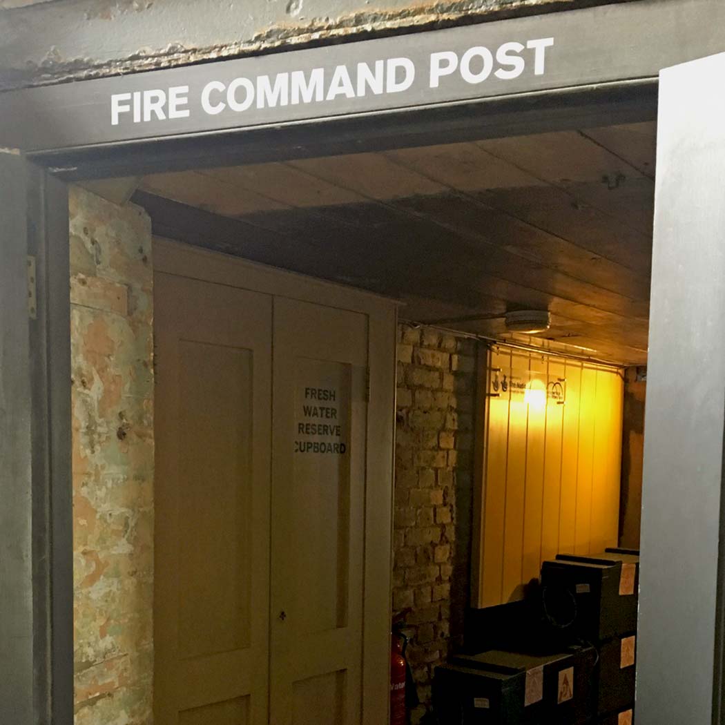Doorway with Fire Command Post, witten on plinth.