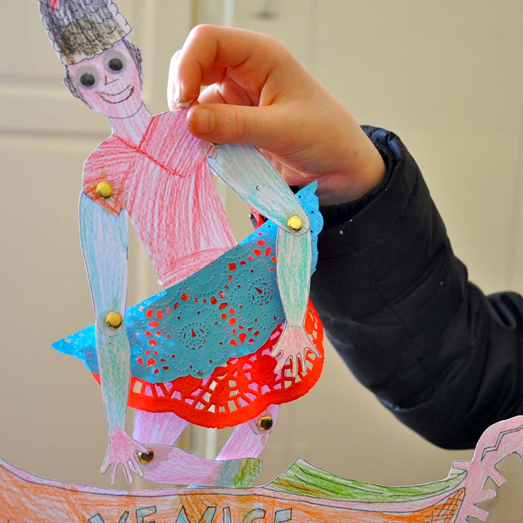 Colourful, child's paper person crreated through art activity.