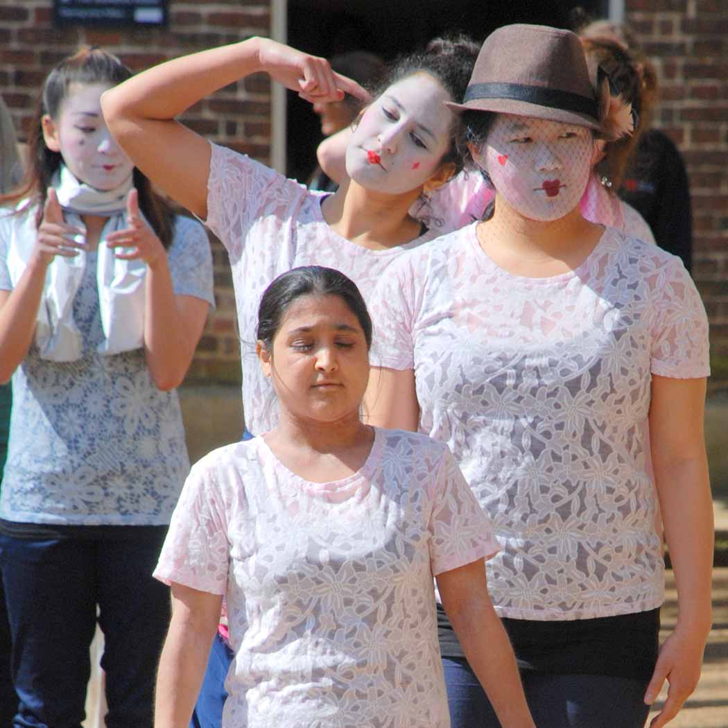 Young people taking part in contempoary dance.