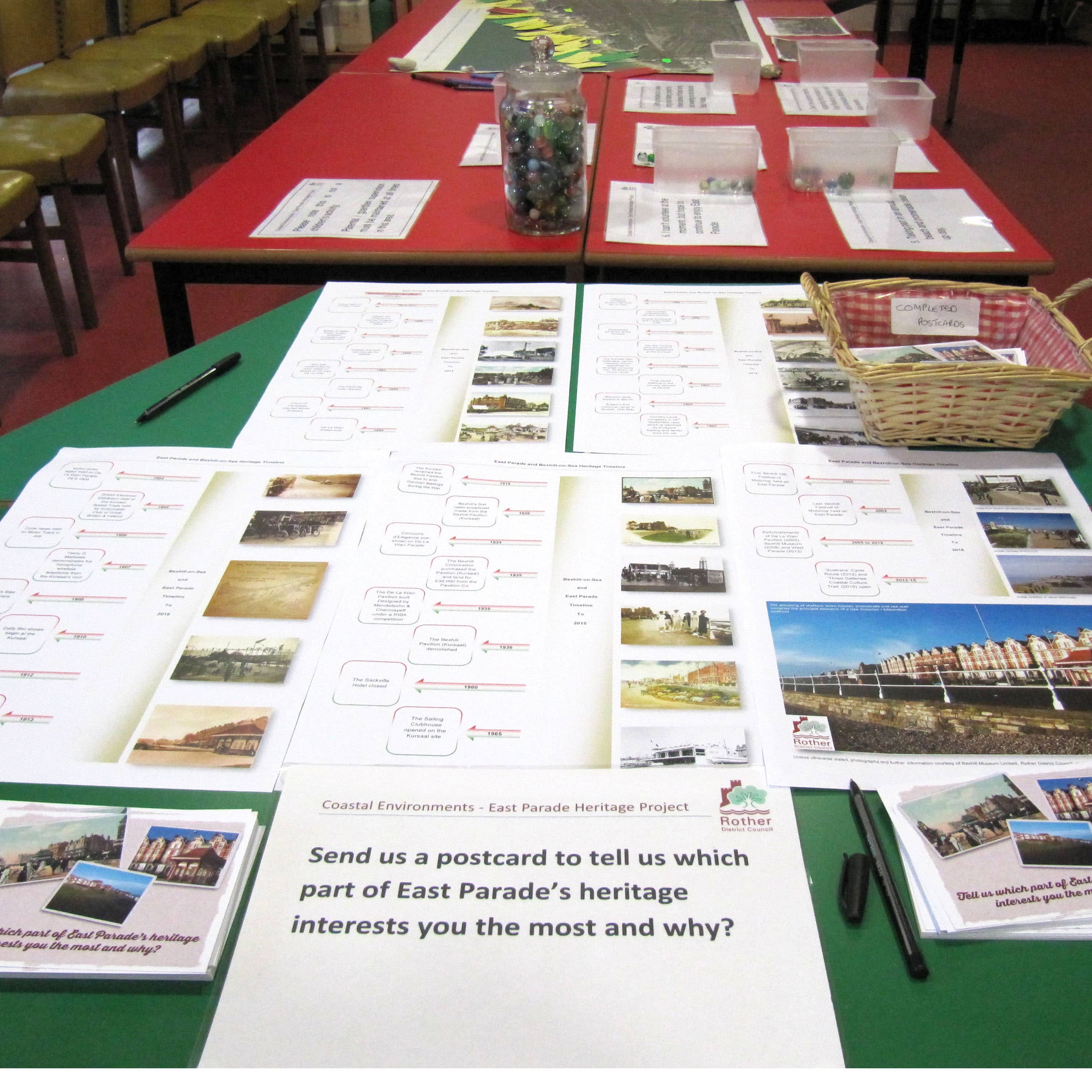 Table with boards and images and text on, asking people to provide feedback.