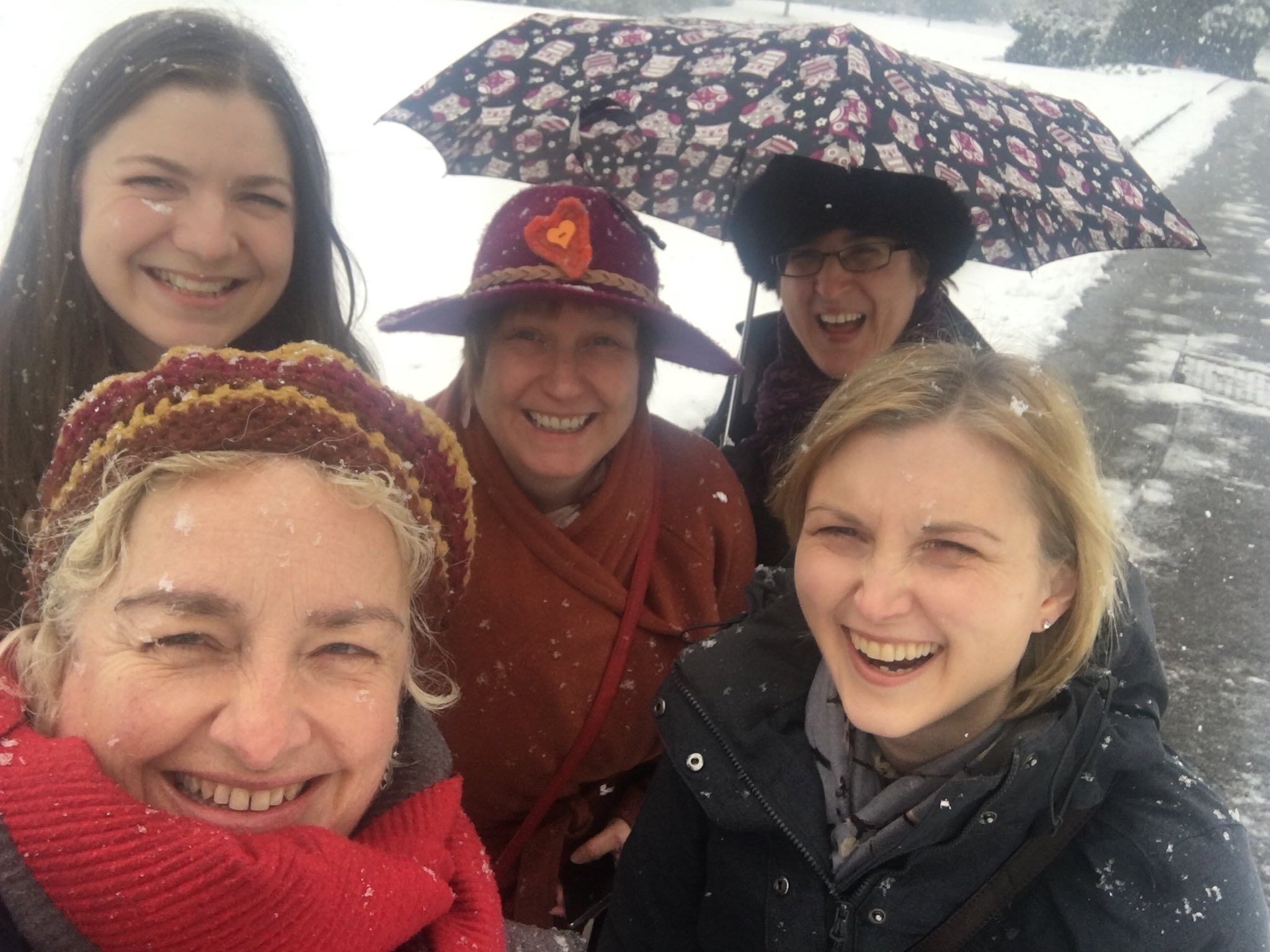 a close up for five women in the snow.