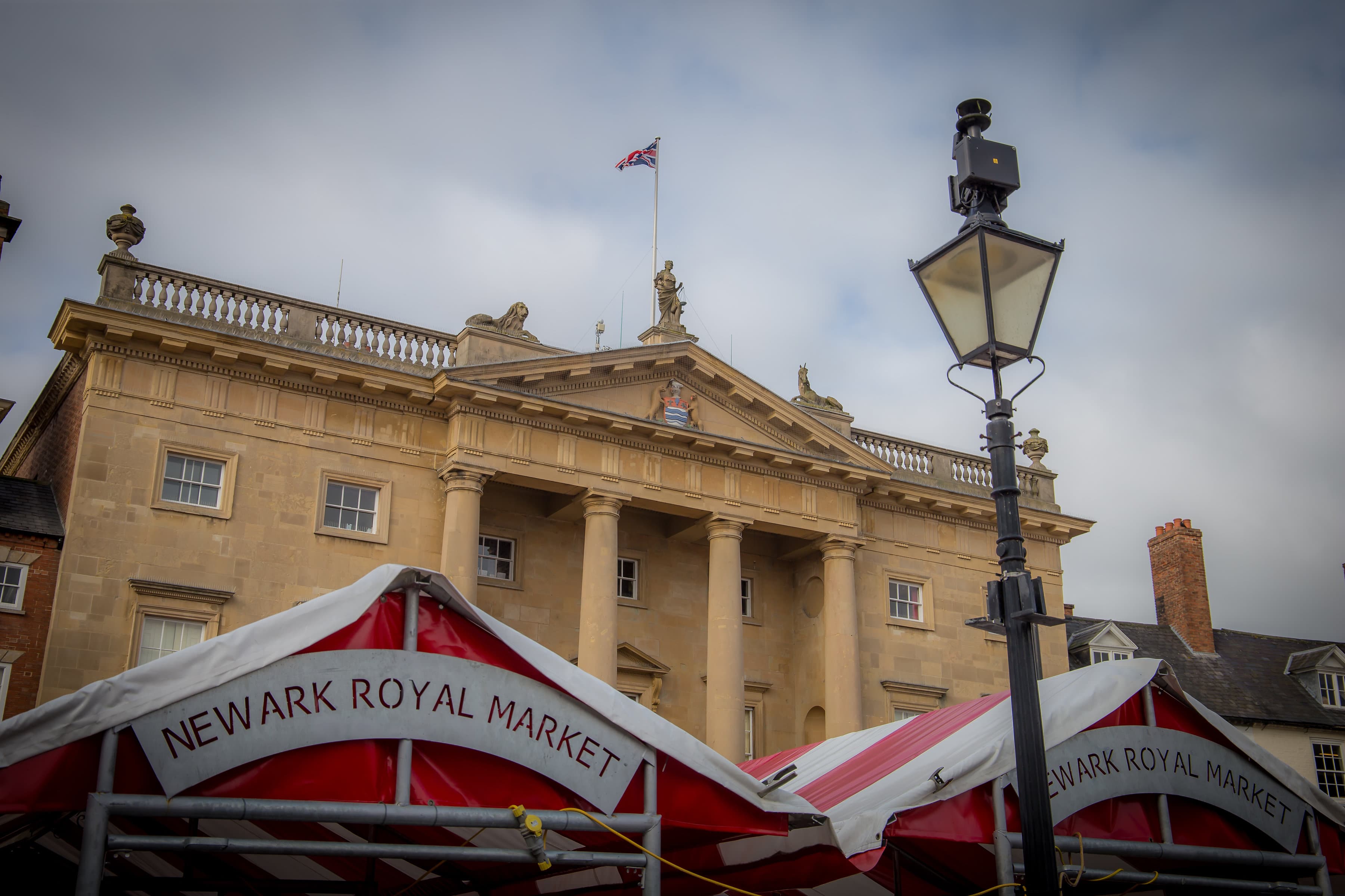 building with market stalls outside