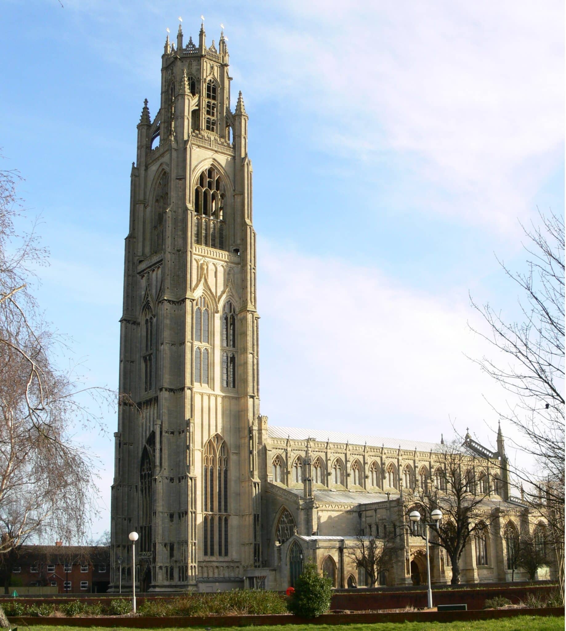 A stone church with very tall spire. 